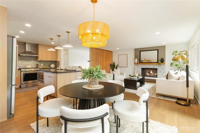 21 165th Ave SE, Bellevue, WA 98008 - dining area with light wood-style floors, recessed lighting, and a fireplace