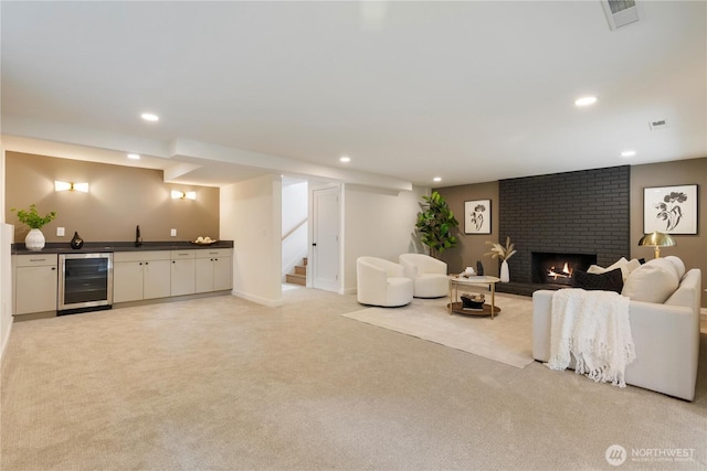 21 165th Ave SE, Bellevue, WA 98008 - living room with beverage cooler, wet bar, light colored carpet, recessed lighting, and stairway