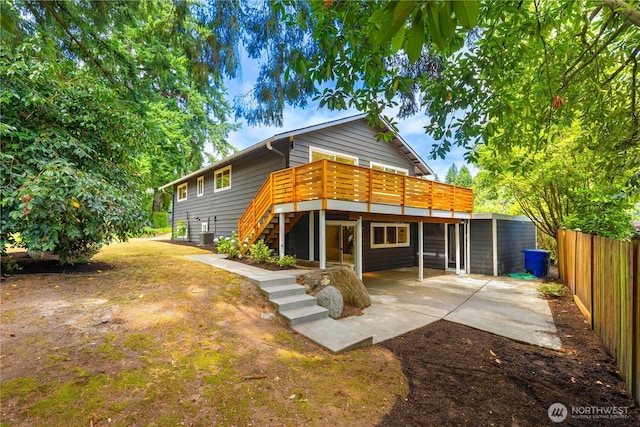 21 165th Ave SE, Bellevue, WA 98008 - rear view of property with stairway, a wooden deck, and a patio area