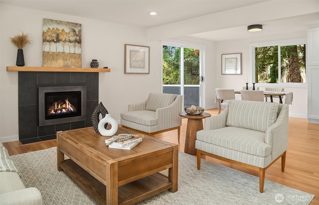 8004 203rd Pl SW, Edmonds, WA 98026 - living room featuring plenty of natural light, light wood-type flooring, a tile fireplace, and recessed lighting