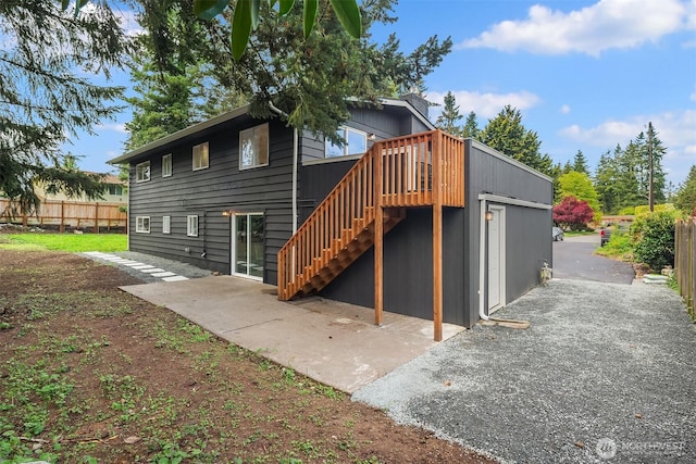 8004 203rd Pl SW, Edmonds, WA 98026 - back of house featuring stairs, a wooden deck, and a patio area