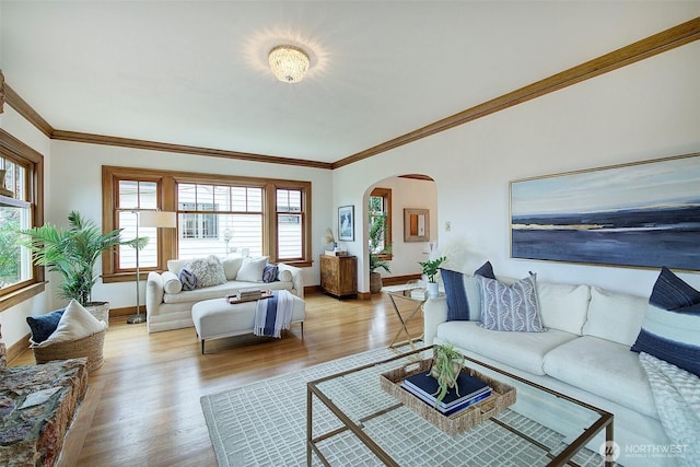2663 37th Ave SW, Seattle, WA 98126 - living area with arched walkways, crown molding, and light wood finished floors
