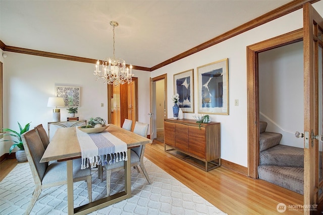 2663 37th Ave SW, Seattle, WA 98126 - dining area with light wood-type flooring, crown molding, a chandelier, and stairway