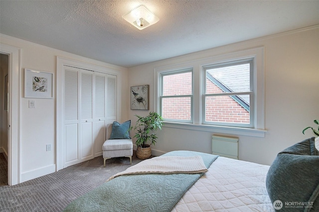 2663 37th Ave SW, Seattle, WA 98126 - carpeted bedroom featuring multiple windows, a closet, crown molding, and a textured ceiling