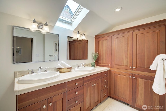 2663 37th Ave SW, Seattle, WA 98126 - full bathroom with a skylight, lofted ceiling, double vanity, and tile patterned flooring