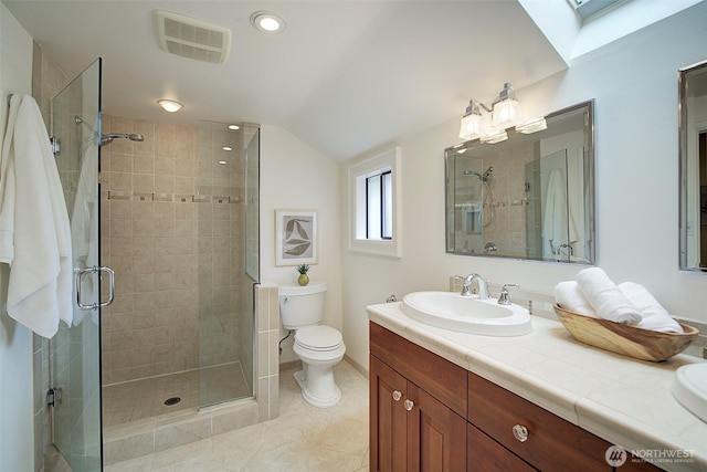 2663 37th Ave SW, Seattle, WA 98126 - bathroom with vanity, a shower stall, a skylight, vaulted ceiling, and recessed lighting