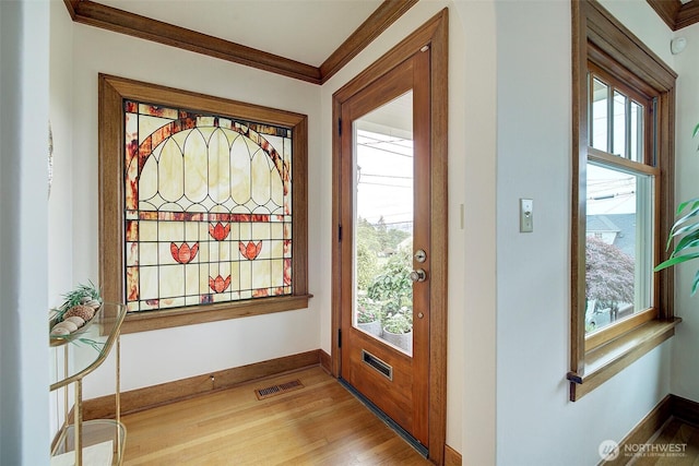 2663 37th Ave SW, Seattle, WA 98126 - foyer featuring light wood-style flooring and crown molding