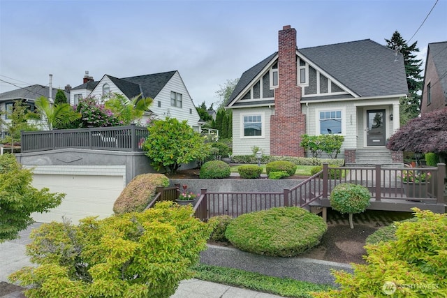 2663 37th Ave SW, Seattle, WA 98126 - view of front of property featuring a chimney, roof with shingles, and a garage