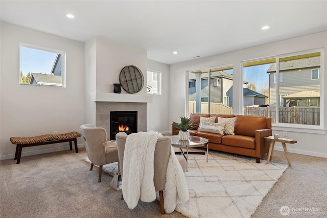 7164 91st St E, Puyallup, WA 98371 - living room featuring light colored carpet, a tile fireplace, and recessed lighting