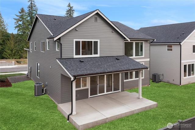 7164 91st St E, Puyallup, WA 98371 - rear view of house featuring a shingled roof, a yard, and a patio area