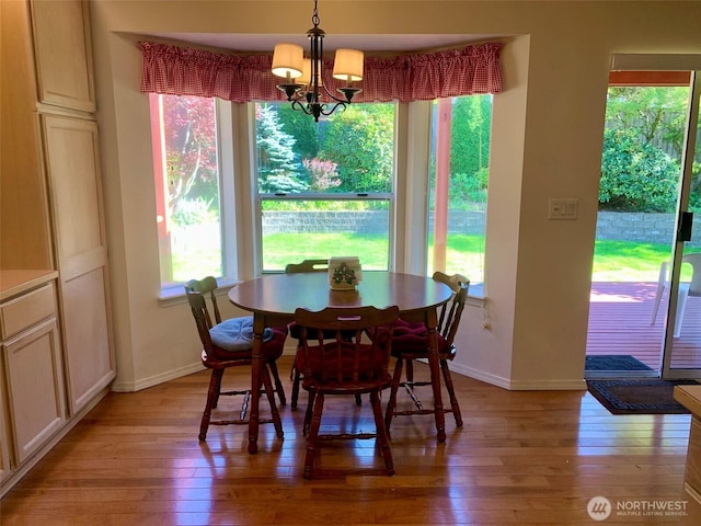 6214 145th St SE, Everett, WA 98208 - dining space featuring light wood-type flooring and a chandelier