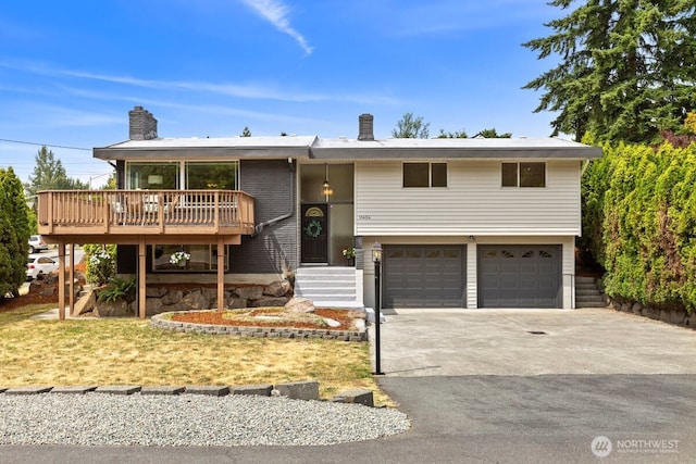 11404 SE 186th St, Renton, WA 98055 - split foyer home with a garage, a chimney, driveway, and a wooden deck