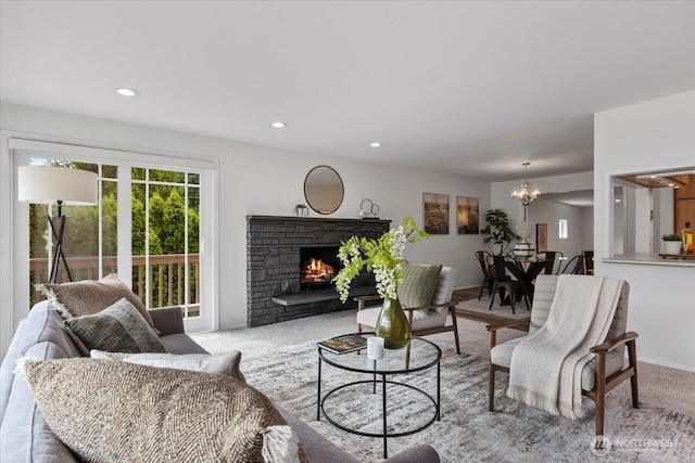 11404 SE 186th St, Renton, WA 98055 - carpeted living room featuring a chandelier, recessed lighting, and a fireplace
