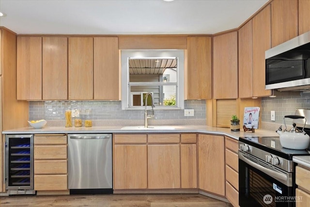11404 SE 186th St, Renton, WA 98055 - kitchen with appliances with stainless steel finishes, wine cooler, light countertops, and backsplash