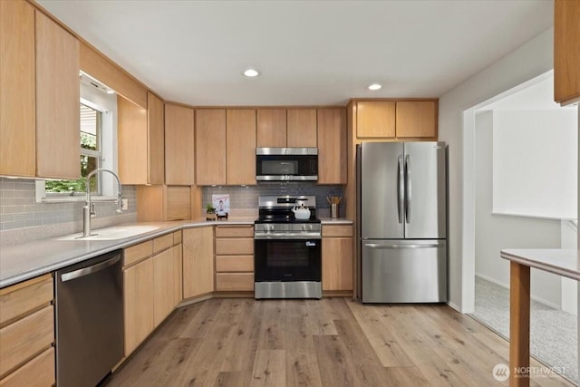 11404 SE 186th St, Renton, WA 98055 - kitchen with appliances with stainless steel finishes, light brown cabinetry, light countertops, light wood-style floors, and recessed lighting