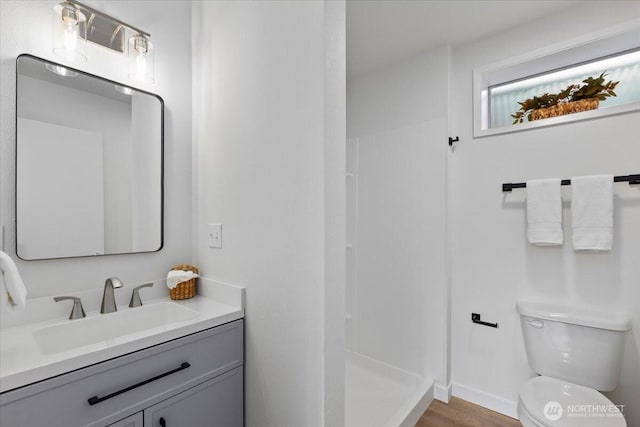 11404 SE 186th St, Renton, WA 98055 - full bathroom with vanity, a stall shower, and wood finished floors