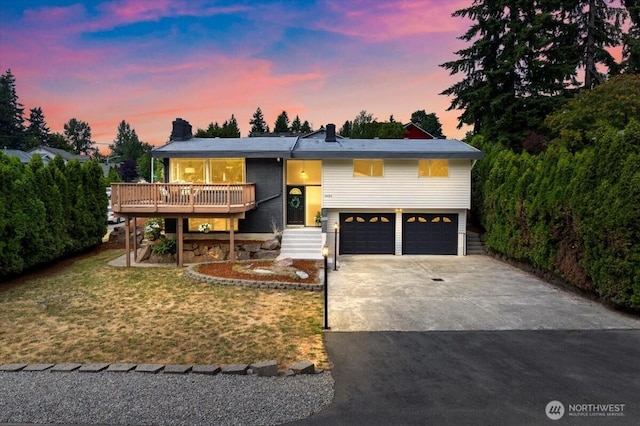 11404 SE 186th St, Renton, WA 98055 - view of front facade featuring driveway, a garage, a chimney, and a front lawn
