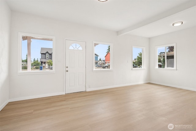 910 E 60th St, Tacoma, WA 98404 - foyer with plenty of natural light, light wood-style flooring, and beamed ceiling