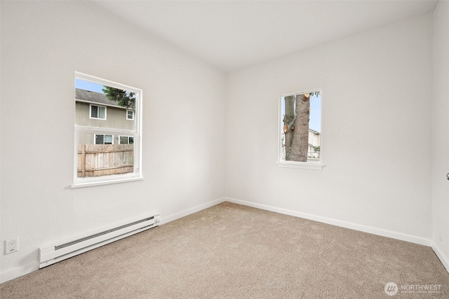 910 E 60th St, Tacoma, WA 98404 - unfurnished room with a baseboard heating unit and carpet flooring