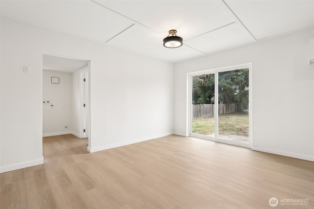 910 E 60th St, Tacoma, WA 98404 - spare room featuring attic access and light wood finished floors