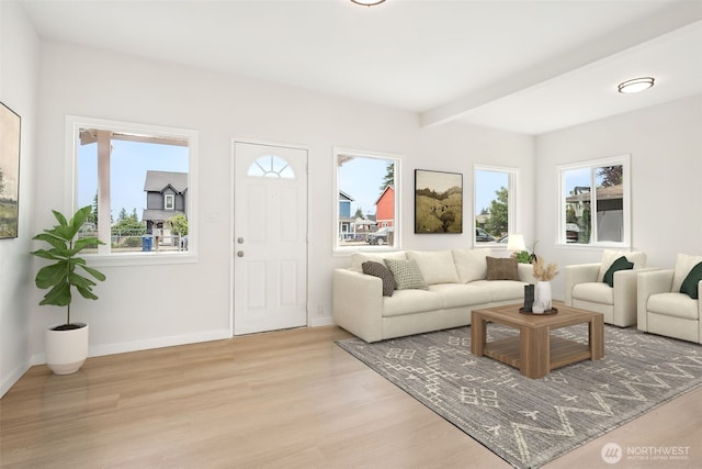 910 E 60th St, Tacoma, WA 98404 - living area with light wood-style floors and beamed ceiling