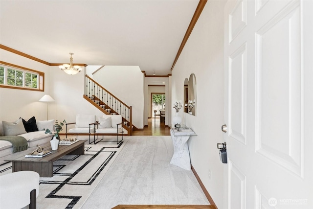18231 2nd Pl W Unit A, Bothell, WA 98012 - living area with a chandelier, crown molding, stairs, and arched walkways