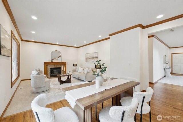 18231 2nd Pl W Unit A, Bothell, WA 98012 - living area with crown molding, light wood-style flooring, recessed lighting, and a glass covered fireplace