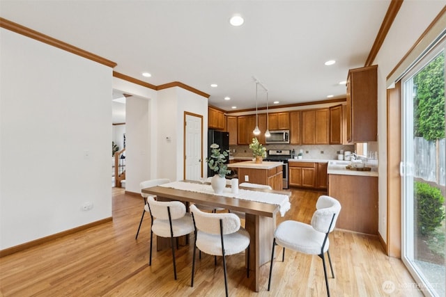 18231 2nd Pl W Unit A, Bothell, WA 98012 - dining space with light wood-style floors, recessed lighting, and crown molding
