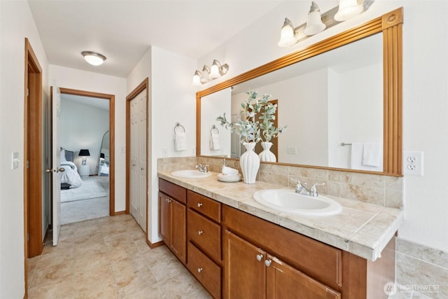 18231 2nd Pl W Unit A, Bothell, WA 98012 - ensuite bathroom featuring double vanity and tile patterned floors