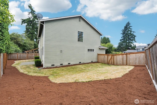 18231 2nd Pl W Unit A, Bothell, WA 98012 - back of property with crawl space and a fenced backyard