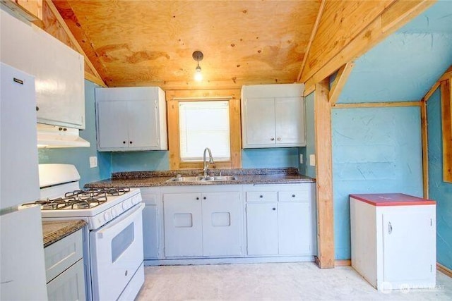 45401 Nellie Ln, Concrete, WA 98237 - kitchen with white appliances, under cabinet range hood, white cabinets, and dark countertops
