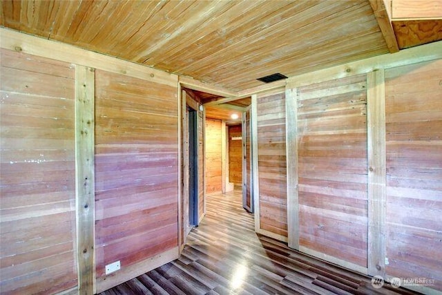 45401 Nellie Ln, Concrete, WA 98237 - corridor featuring wooden walls, wooden ceiling, and wood finished floors