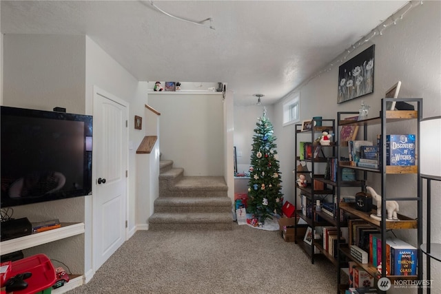 1723 E 13th Ave, Spokane, WA 99202 - living area featuring carpet flooring, stairway, and a textured wall