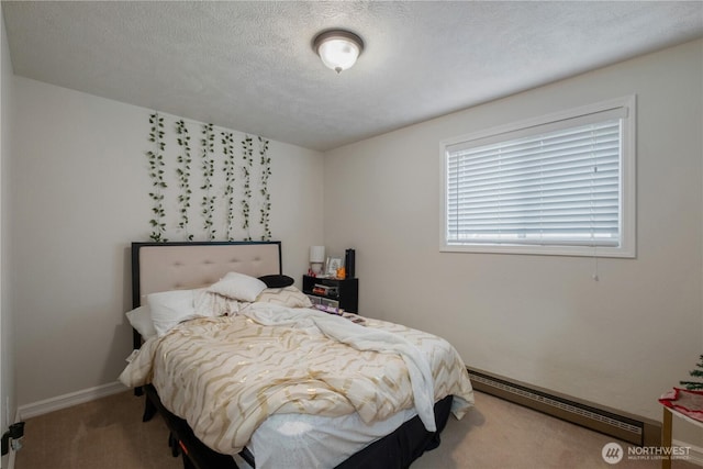 1723 E 13th Ave, Spokane, WA 99202 - bedroom featuring baseboard heating and carpet floors