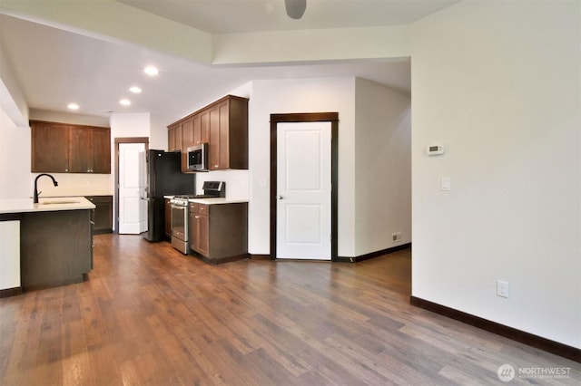 17723 3rd Ave SE, Bothell, WA 98012 - kitchen with appliances with stainless steel finishes, recessed lighting, light countertops, and dark wood-style flooring