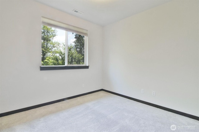 17723 3rd Ave SE, Bothell, WA 98012 - spare room featuring carpet flooring and baseboards