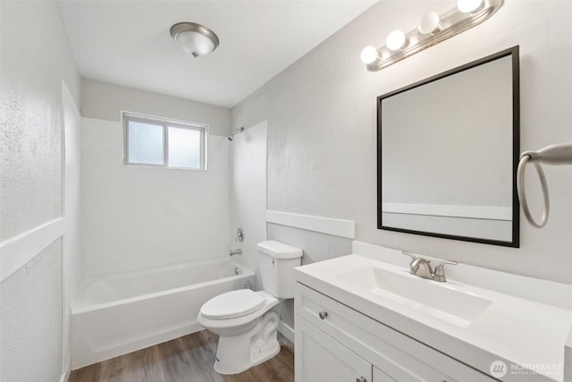 9442 S K St, Tacoma, WA 98444 - full bathroom featuring wood finished floors, vanity, and tub / shower combination