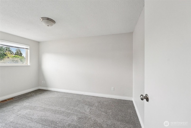 9442 S K St, Tacoma, WA 98444 - empty room featuring carpet and a textured ceiling