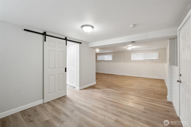 9442 S K St, Tacoma, WA 98444 - below grade area with a barn door and light wood-style flooring