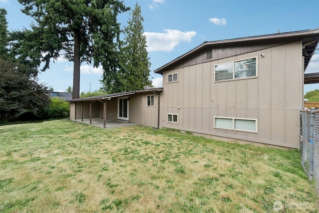 9442 S K St, Tacoma, WA 98444 - back of house featuring a patio area and a lawn