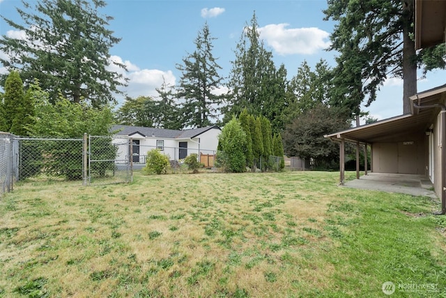 9442 S K St, Tacoma, WA 98444 - fenced backyard featuring a patio area