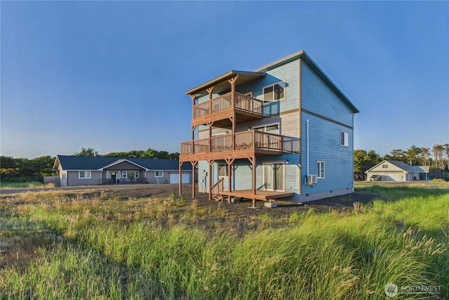 612 Dune Crest Loop, Westport, WA 98595 - rear view of house with a balcony, cooling unit, a wooden deck, and crawl space