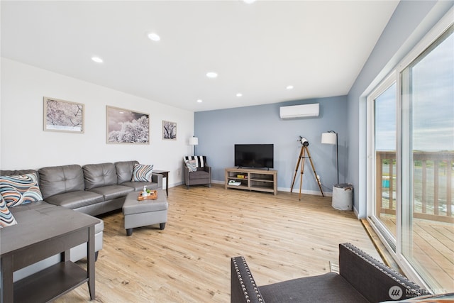 612 Dune Crest Loop, Westport, WA 98595 - living room featuring a wall mounted AC, light wood-style floors, and recessed lighting