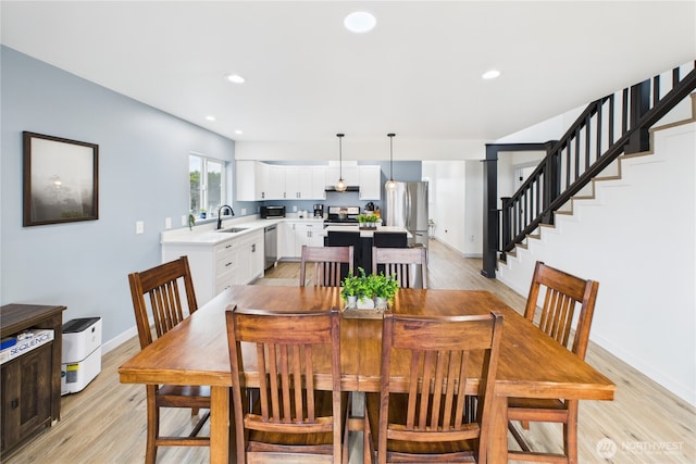 612 Dune Crest Loop, Westport, WA 98595 - dining area featuring light wood-style floors, recessed lighting, and stairs