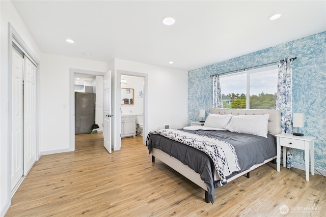 612 Dune Crest Loop, Westport, WA 98595 - bedroom featuring wallpapered walls, light wood-style floors, recessed lighting, and ensuite bathroom