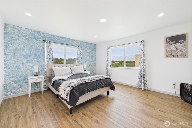 612 Dune Crest Loop, Westport, WA 98595 - bedroom featuring multiple windows, wallpapered walls, light wood finished floors, and recessed lighting