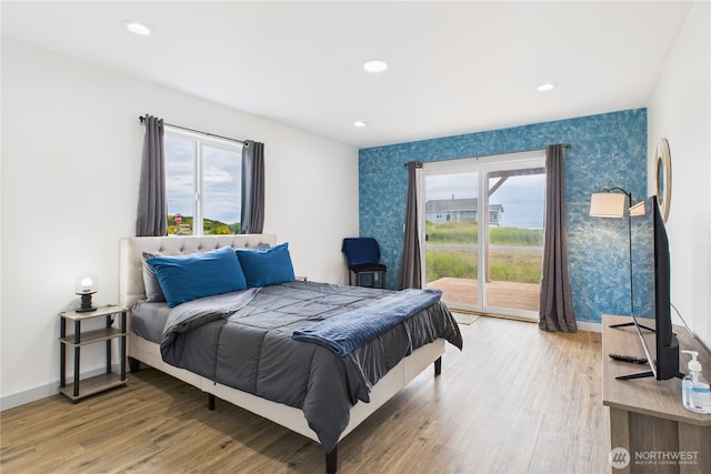 612 Dune Crest Loop, Westport, WA 98595 - bedroom with wallpapered walls, access to outside, light wood-type flooring, and recessed lighting
