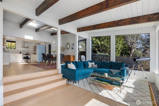 28605 Manzanita Beach Rd SW, Vashon, WA 98070 - living area featuring wood finished floors and beamed ceiling