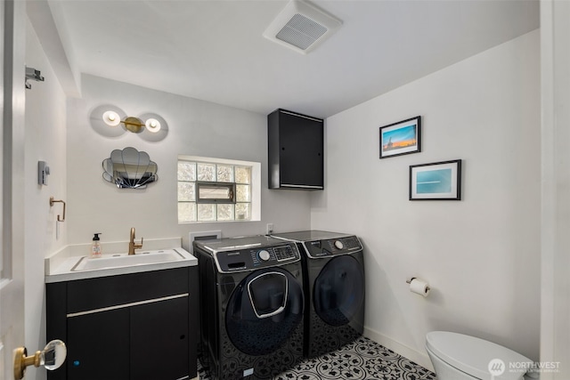 28605 Manzanita Beach Rd SW, Vashon, WA 98070 - bathroom featuring independent washer and dryer, tile patterned flooring, and vanity