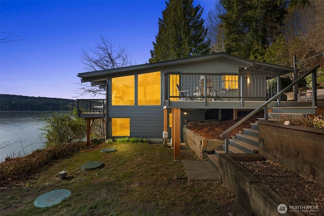 28605 Manzanita Beach Rd SW, Vashon, WA 98070 - view of front facade featuring stairs and a deck with water view